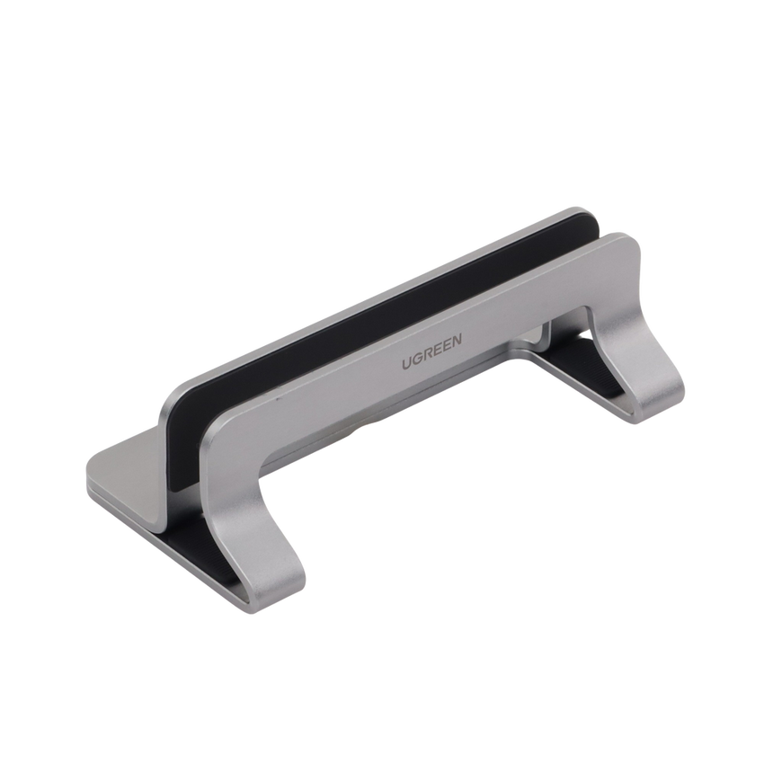 Soporte Vertical para Laptop / Adecuado para escritorio / Anchura Ajustable (12-26mm) / Amplia compatibilidad / Anti-Arañazos / Anti-Deslizante /Ajustable Mediante Tornillos / Color Plata / Aluminio + Silicona