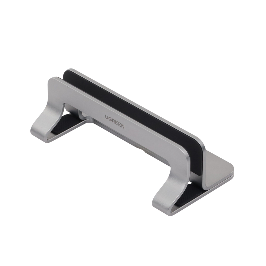 Soporte Vertical para Laptop / Adecuado para escritorio / Anchura Ajustable (12-26mm) / Amplia compatibilidad / Anti-Arañazos / Anti-Deslizante /Ajustable Mediante Tornillos / Color Plata / Aluminio + Silicona