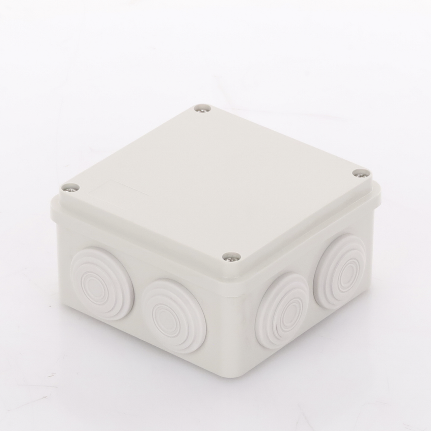 Caja Derivación-Conexión de Plástico (100 X 100 X 54 mm) con 7 Glándulas de Goma. Para Instalaciones Comerciales, Residenciales e Industriales. Incluye Tornillería para su Tapa.