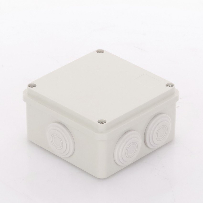 Caja Derivación-Conexión de Plástico (100 X 100 X 54 mm) con 7 Glándulas de Goma. Para Instalaciones Comerciales, Residenciales e Industriales. Incluye Tornillería para su Tapa.